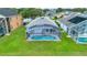 An aerial view shows the screened-in pool and manicured lawn of this well-maintained home at 4347 Creekside Blvd, Kissimmee, FL 34746