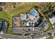 Overhead shot of a community amenity center with pool, splashpad, playground, parking, and landscaping at 4591 Gliding Wave St, Winter Garden, FL 34787