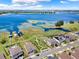Aerial view of waterfront homes with private docks and lake access, near a neighborhood park at 4591 Gliding Wave St, Winter Garden, FL 34787