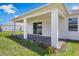 This covered back porch features brick pavers, and a sliding glass door leads inside the home at 4591 Gliding Wave St, Winter Garden, FL 34787