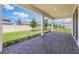 Covered outdoor living space features brick pavers, pillars, and a view of the backyard's lawn and fence at 4591 Gliding Wave St, Winter Garden, FL 34787