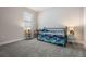Bedroom with a window, carpet, and a bed with sea themed covers at 4591 Gliding Wave St, Winter Garden, FL 34787