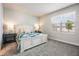 Bright bedroom with neutral carpet, a comfy bed, and plenty of natural light from the window at 4591 Gliding Wave St, Winter Garden, FL 34787