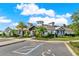 A modern community clubhouse with professional landscaping, accessible parking, and covered entryway at 4591 Gliding Wave St, Winter Garden, FL 34787