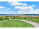 Scenic lake view from the community park with walking path and a wooden dock at 4591 Gliding Wave St, Winter Garden, FL 34787