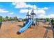 Community playground featuring slides, swings, and climbing structures set on wood mulch at 4591 Gliding Wave St, Winter Garden, FL 34787