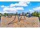 Community playground with swings, slides, and play equipment, set on a wood mulch surface at 4591 Gliding Wave St, Winter Garden, FL 34787
