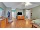 Large bedroom featuring hardwood floors, natural light, and a ceiling fan at 516 Fort Smith Blvd, Deltona, FL 32738