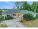 Charming single-story home featuring a well-manicured lawn and inviting entrance at 516 Fort Smith Blvd, Deltona, FL 32738