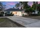 Charming single-story home with well-maintained landscaping and a spacious driveway at 516 Fort Smith Blvd, Deltona, FL 32738