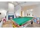 Spacious room with fireplace, bar and a pool table at 516 Fort Smith Blvd, Deltona, FL 32738