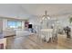 Inviting living area with a dining area, a view to the outdoor area, and hardwood floors at 516 Fort Smith Blvd, Deltona, FL 32738