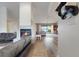 Open living space with fireplace and sliding glass doors to the pool at 516 Fort Smith Blvd, Deltona, FL 32738