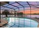 Beautiful screened-in pool with lake views and plenty of sunshine at 516 Fort Smith Blvd, Deltona, FL 32738