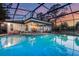 Beautiful pool area enclosed by a screen, offering views of the surrounding landscape at 516 Fort Smith Blvd, Deltona, FL 32738