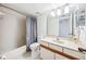 Clean bathroom features a shower-tub combo and marble vanity at 530 E Central Blvd # 1702, Orlando, FL 32801