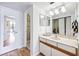 Clean bathroom featuring a shower, vanity, and modern fixtures at 530 E Central Blvd # 1702, Orlando, FL 32801