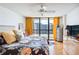 Modern bedroom features natural light and a stylish decor at 530 E Central Blvd # 1702, Orlando, FL 32801