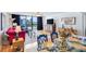 Stylish living and dining area showcasing hardwood floors, modern furniture, and city views at 530 E Central Blvd # 1702, Orlando, FL 32801