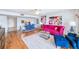 Open living space with hardwood flooring, unique decor, and a seamless transition to the dining area at 530 E Central Blvd # 1702, Orlando, FL 32801