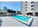 Enjoy a relaxing swim in this luxurious condo swimming pool with comfortable lounge chairs at 530 E Central Blvd # 1702, Orlando, FL 32801