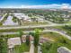Aerial view of the property's surrounding neighborhood, near a school and canal at 5481 Nokomis Cir, Orlando, FL 32839