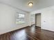 Bright bedroom with hardwood floors, window, and closet, offering a cozy retreat at 5481 Nokomis Cir, Orlando, FL 32839