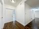 Bright entryway featuring wood floors, white walls, and a view to other rooms at 5481 Nokomis Cir, Orlando, FL 32839