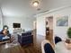 Spacious living room with wood floors, modern decor, and an open floor plan at 5481 Nokomis Cir, Orlando, FL 32839