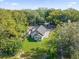 Aerial view of a house with lush green grass and tree lined streets at 600 Lakewood Ave, Ocoee, FL 34761