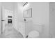 Bathroom with single sink vanity and view into the kitchen at 600 Lakewood Ave, Ocoee, FL 34761