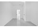 Bright bedroom featuring marble floors, and white walls with two entrances at 600 Lakewood Ave, Ocoee, FL 34761