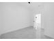 White bedroom featuring marble floors and a view into the hall at 600 Lakewood Ave, Ocoee, FL 34761