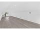 Large bonus room featuring wood-look floors and bright natural light at 600 Lakewood Ave, Ocoee, FL 34761