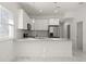 Modern kitchen features stainless steel appliances, gray countertops and white cabinetry at 600 Lakewood Ave, Ocoee, FL 34761