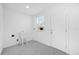 Laundry room featuring a utility sink, window, and access to the exterior at 600 Lakewood Ave, Ocoee, FL 34761