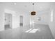 Spacious living room with marble floors, recessed lighting, and a modern pendant light at 600 Lakewood Ave, Ocoee, FL 34761
