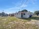 Home with a private backyard, featuring a well maintained fence, and an access door at 619 Carver Dr, Lake Wales, FL 33853