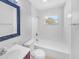 Clean bathroom featuring a shower and tub combo and framed mirror at 619 Carver Dr, Lake Wales, FL 33853