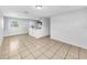 Bright open living room with tile flooring and neutral walls offers great natural light at 619 Carver Dr, Lake Wales, FL 33853
