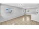 Bright and open living room with tile flooring and natural light for a cozy space at 619 Carver Dr, Lake Wales, FL 33853