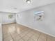 Spacious living room with tiled floor and natural light at 619 Carver Dr, Lake Wales, FL 33853