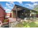 Fenced backyard with covered lanai and brick patio area, ideal for entertaining at 6701 Belmar Dr, Orlando, FL 32807