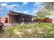 Backyard featuring a covered lanai and grass area, great for outdoor enjoyment at 6701 Belmar Dr, Orlando, FL 32807
