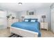 Comfortable main bedroom features a large window, neutral walls and decor, and tile flooring at 6701 Belmar Dr, Orlando, FL 32807