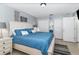Comfortable main bedroom features a large window, neutral walls and decor, and tile flooring at 6701 Belmar Dr, Orlando, FL 32807