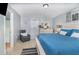 Comfortable main bedroom features a large window, neutral walls and decor, and tile flooring at 6701 Belmar Dr, Orlando, FL 32807