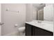 Bathroom with a dark vanity and glass-enclosed shower at 7010 Broomshedge Trl, Winter Garden, FL 34787