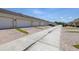 Row of townhomes featuring brick driveways and garages at 7010 Broomshedge Trl, Winter Garden, FL 34787