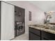 Convenient kitchen area with a laundry closet featuring a modern washer and dryer set at 7010 Broomshedge Trl, Winter Garden, FL 34787